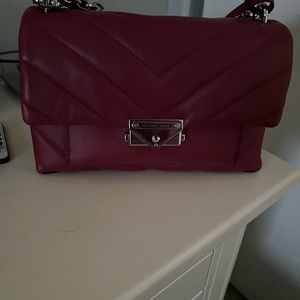 Brand new Maroon Michael Kors purse with chain strap.
